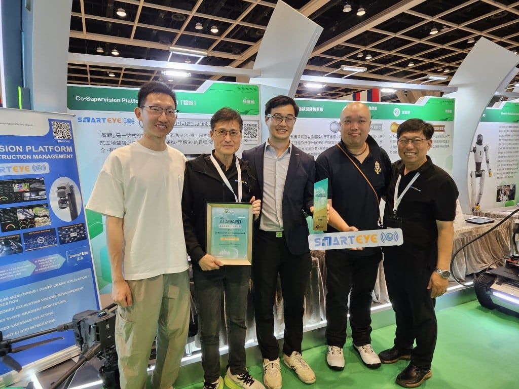 The Kodifly team and the Development Bureau team holding the CIC AI Award 2026 certificate and trophy at the SmartEye booth